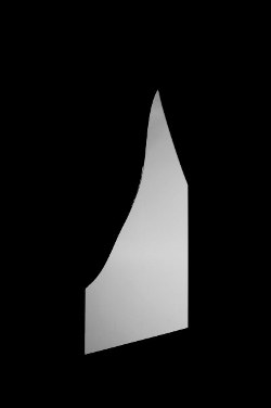 A black cloth backdrop with a single large, light-gray shard of glass